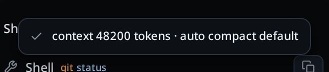 A grey toast card reading "context 48200 tokens · auto compact default", over the conversation.